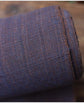 Close-up of textured blue fabric with a geometric pattern on a blurred background